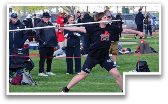A man is throwing a javelin in a field. Description generated by AI
