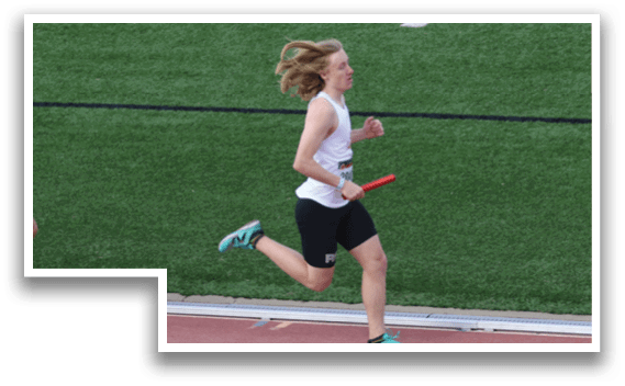 Two people running on a track. Description generated by AI