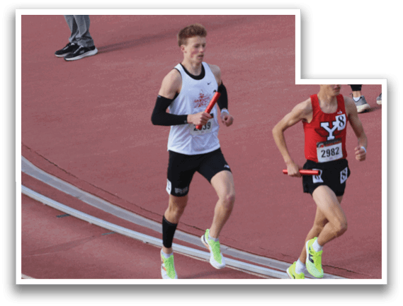 Two runners on a track. Description generated by AI