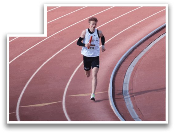 A man running on a track. Description generated by AI