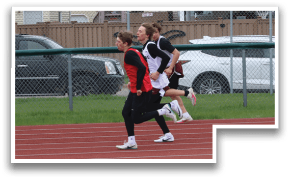A woman running on a track. Description generated by AI