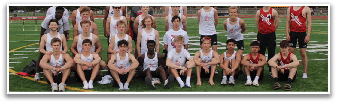 A group of young men and women posing for a picture on a field. Description generated by AI