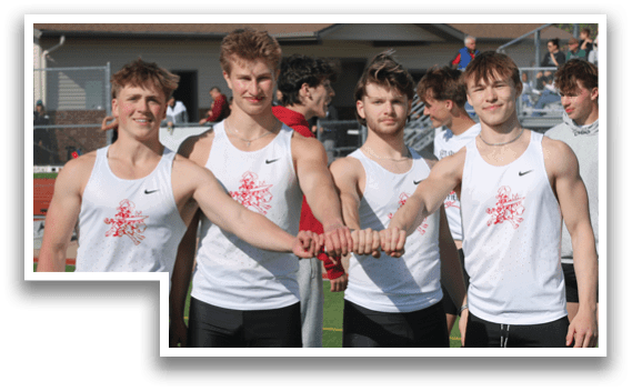 Four men wearing black and white uniforms. Description generated by AI