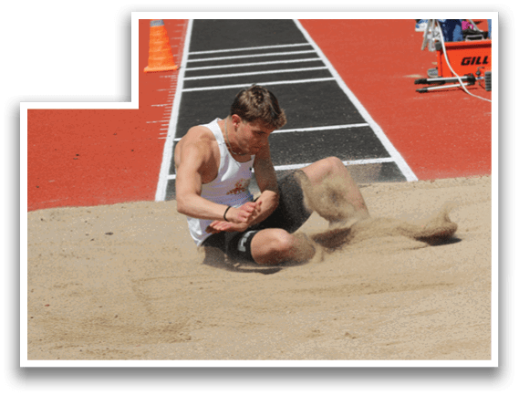 A man is sitting in the sand. Description generated by AI
