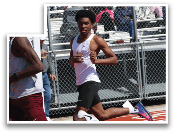 Two men running on a track. Description generated by AI