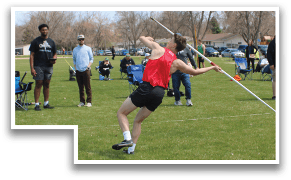 A man in a red shirt is throwing a frisbee. Description generated by AI