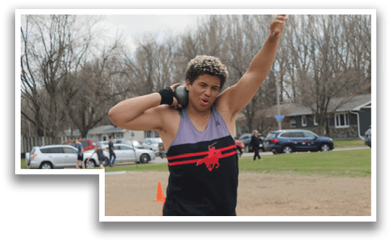 A man wearing a black tank top with a red maple leaf on it. Description generated by AI