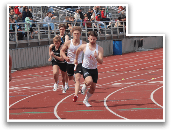A group of people running on a track. Description generated by AI