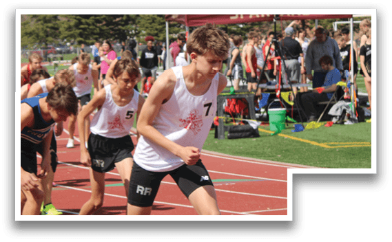 A group of people running on a track. Description generated by AI