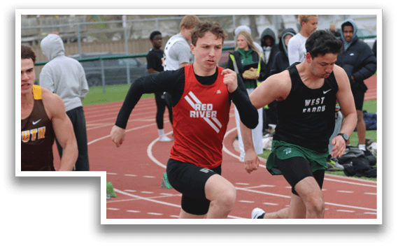 A group of runners on a track. Description generated by AI