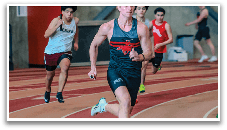 A man running on a track. Description generated by AI