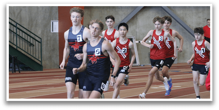 A group of young men running on a track. Description generated by AI