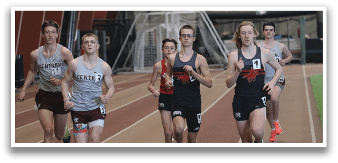 A group of runners on a track. Description generated by AI