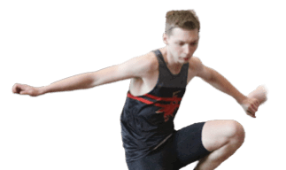 A man wearing a black shirt and black shorts is jumping in the air. Description generated by AI