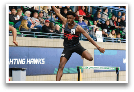 A man is jumping over a hurdle. Description generated by AI