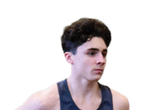 A man running on a track. Description generated by AI