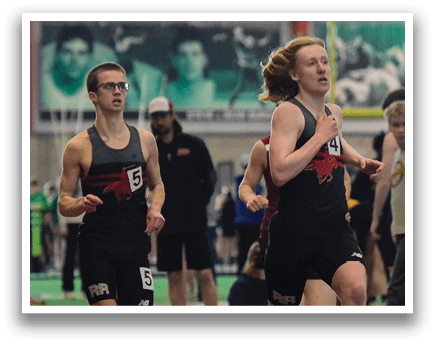 Two men running on a track. Description generated by AI