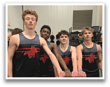 Four men wearing black and red shirts. Description generated by AI
