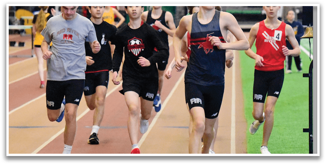 A group of people running on a track. Description generated by AI