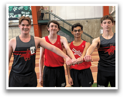 Four men wearing red and black shirts. Description generated by AI