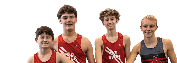 Three young men wearing red and black shirts and shorts. Description generated by AI