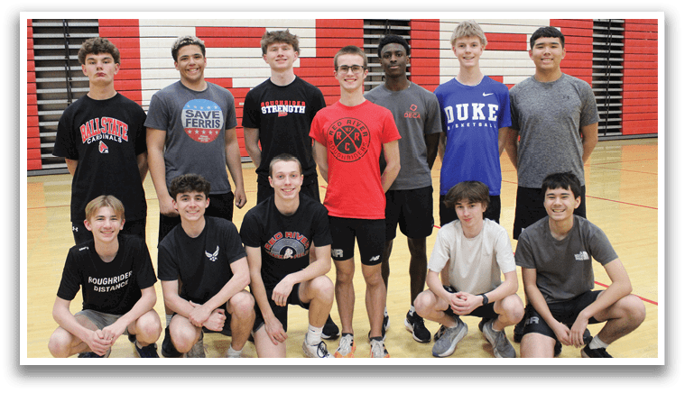 A group of young men in a gym. Description generated by AI