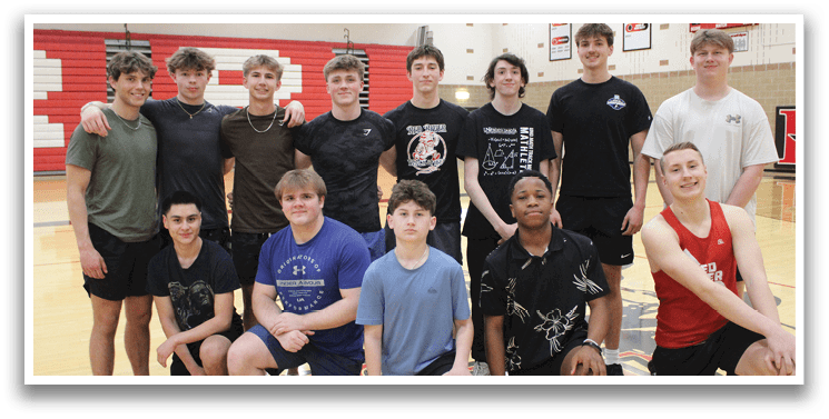 A group of young men and women posing for a picture. Description generated by AI