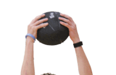 A man holding a black ball. Description generated by AI