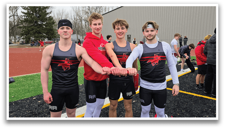 Four men wearing black and red shirts and white socks. Description generated by AI