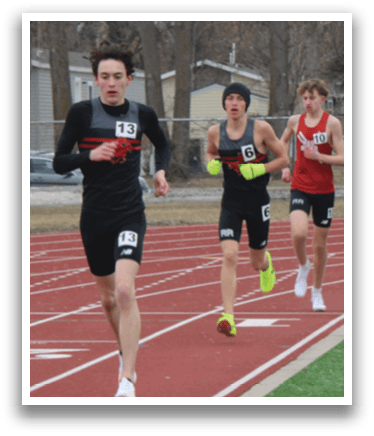 A group of people running on a track. Description generated by AI
