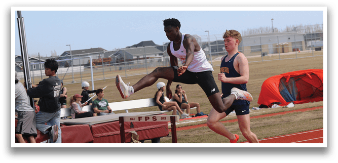 A man is jumping over a barrier. Description generated by AI