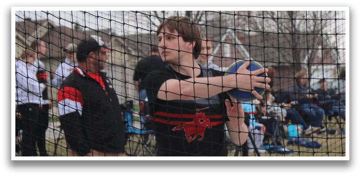 A man is holding a baseball bat and getting ready to swing. Description generated by AI