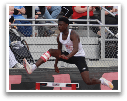 A man is jumping over a hurdle. Description generated by AI