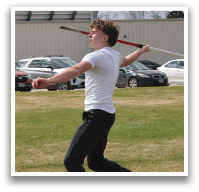 A man in a white shirt and black pants is swinging a bat. Description generated by AI