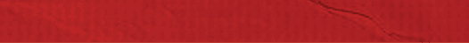 A red piece of paper with a wrinkled surface. Description generated by AI