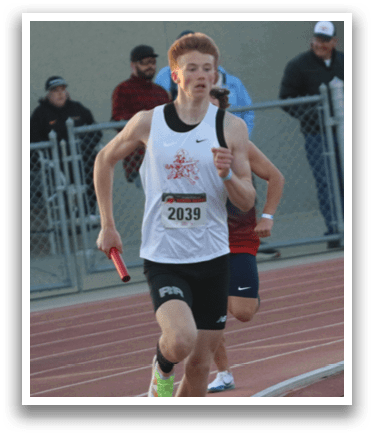 A man running on a track. Description generated by AI
