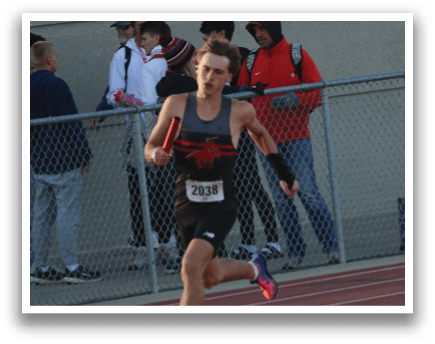 A person running on a track. Description generated by AI