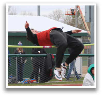 A man is jumping over a barrier. Description generated by AI