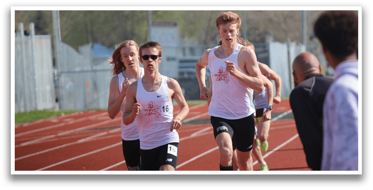 A group of runners on a track. Description generated by AI