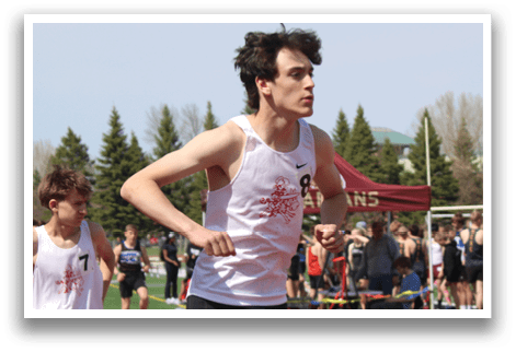 A group of men running on a track. Description generated by AI