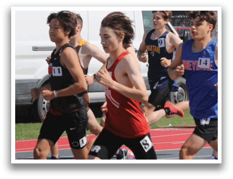A group of people running on a track. Description generated by AI