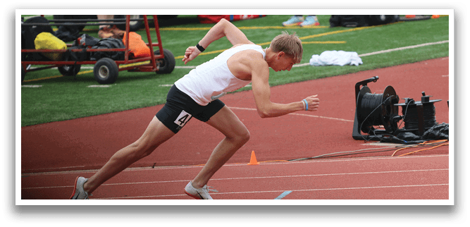 A group of runners on a track. Description generated by AI