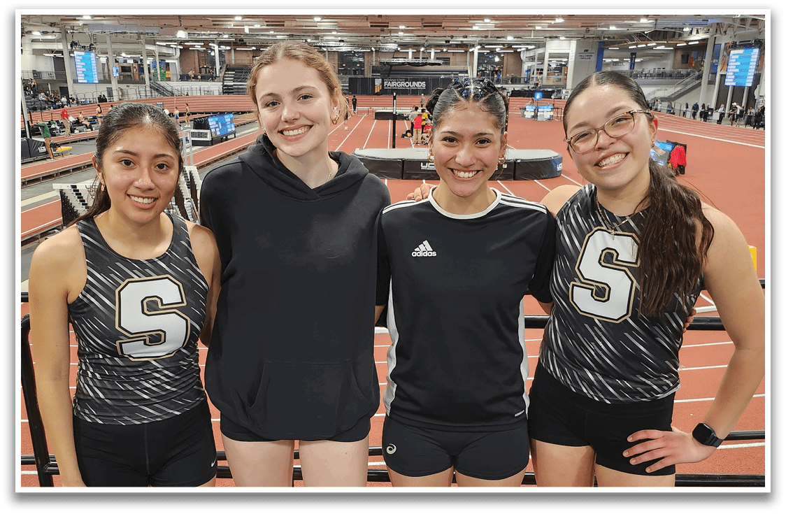 Four female athletes pose for a picture in their uniforms. Contenido generado con IA