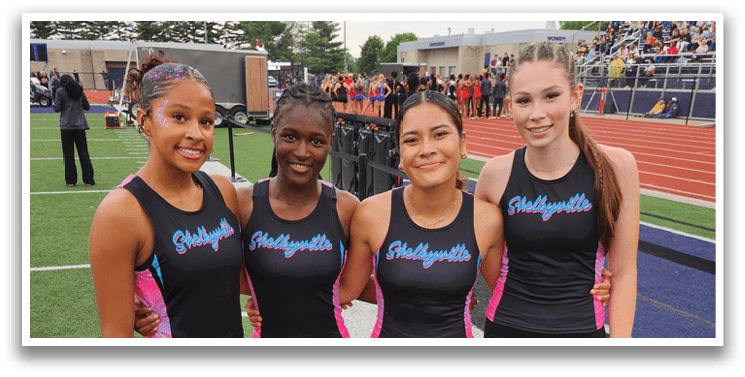A group of girls running on a track, with one girl leading the pack. Contenido generado con IA