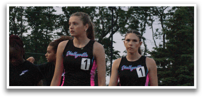 Three female runners wearing sports outfits are running on a track. Contenido generado con IA