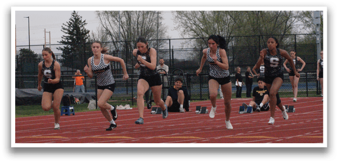 A group of girls are running on a track, wearing uniforms and sneakers. Contenido generado con IA