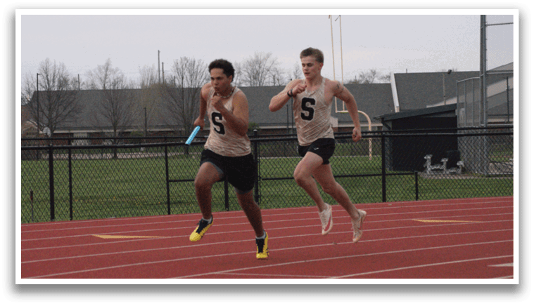 Two men are running on a track, one wearing a number 9 shirt. Contenido generado con IA