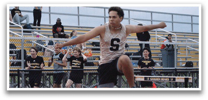 A man is jumping over a hurdle on a track. Contenido generado con IA