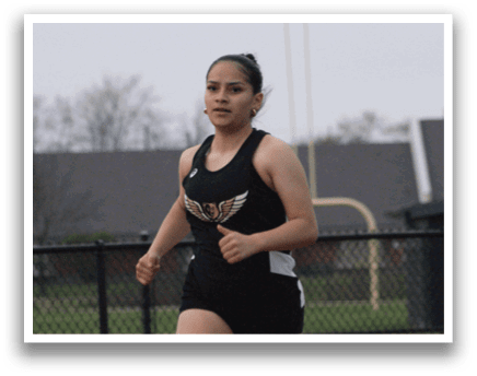 A girl is running on a track, wearing a black and white outfit. Contenido generado con IA