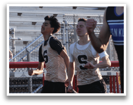 A group of young men running on a track, one of them wearing a Franklin shirt. Contenido generado con IA